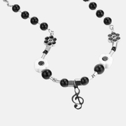 Colar de pérolas de aço inoxidável com notas musicais sorridentes